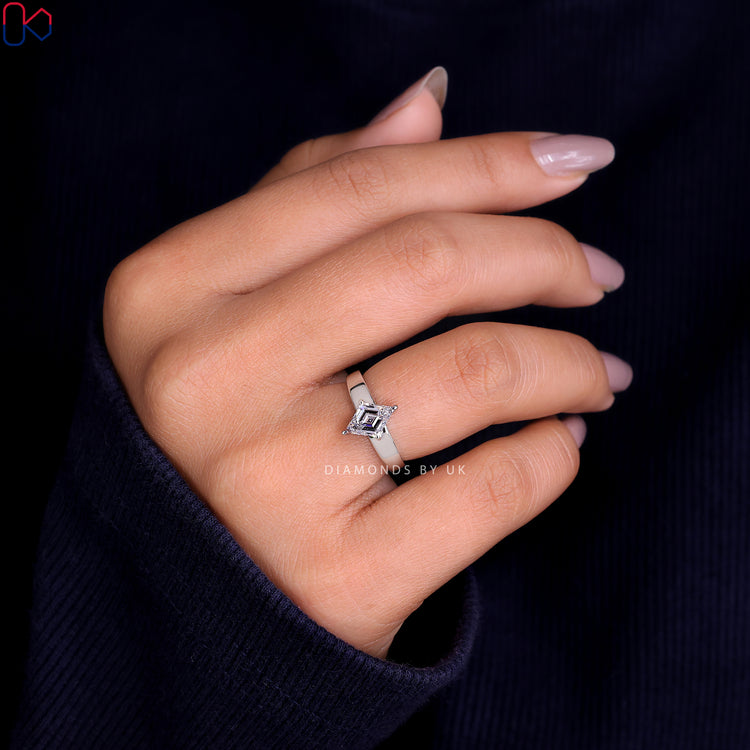 Diamondsbyuk engagement ring featuring a lozenge cut diamond in white gold.
