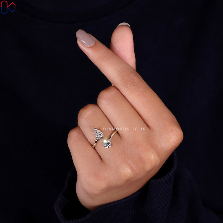 V shaped prong setting holding a beautiful pear cut engagement ring.