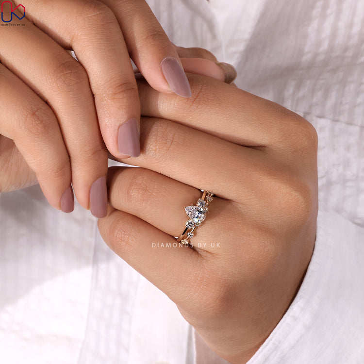 Diamondsbyuk bridal set featuring a pear engagement ring and band.