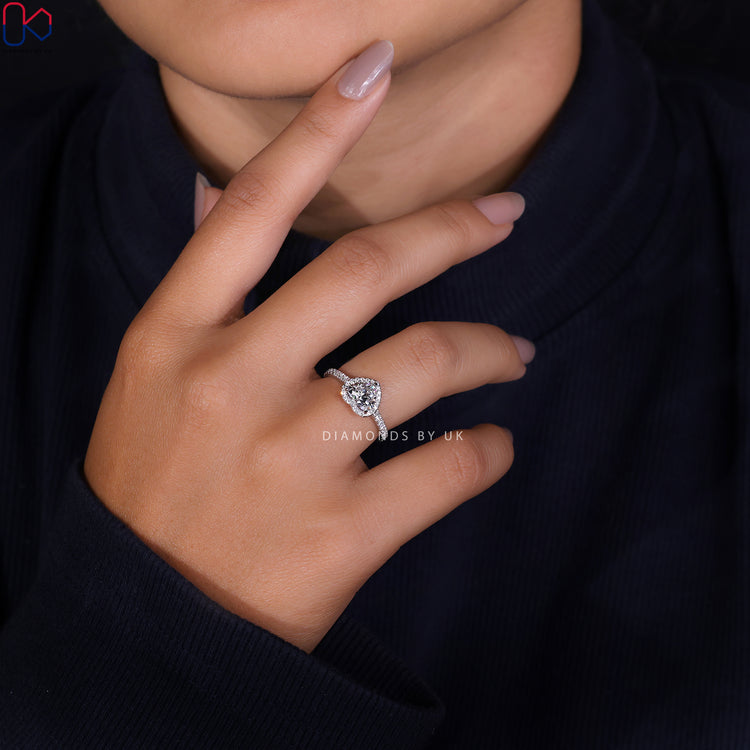 Diamondsbyuk engagement ring with a heart cut diamond and halo setting.
