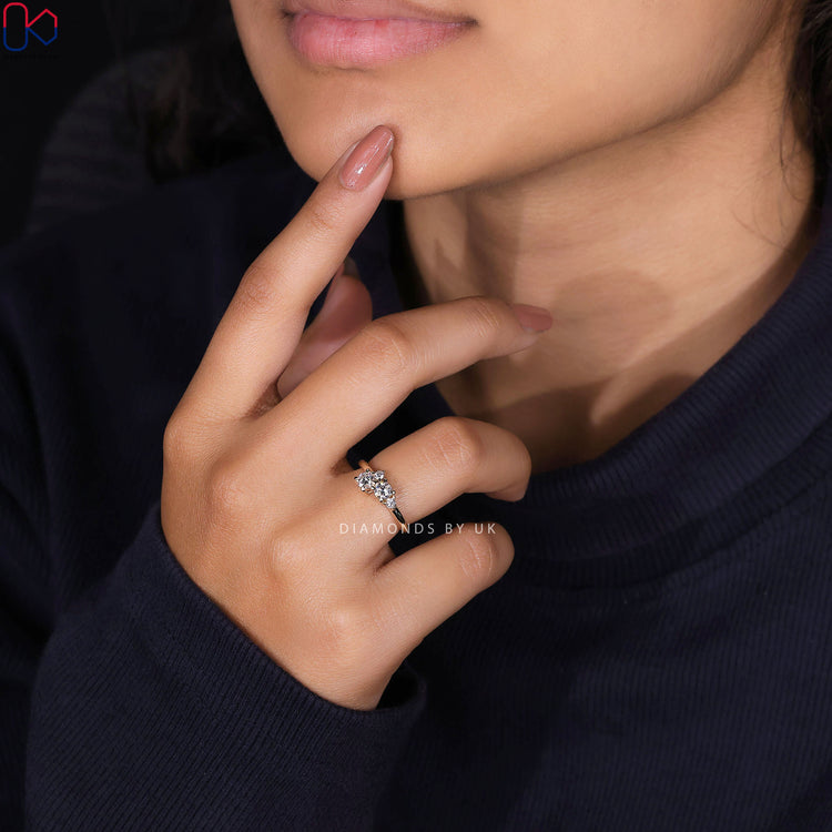 Handmade engagement ring with gold cluster design.
