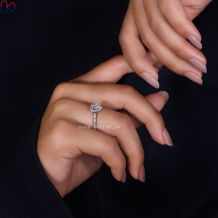 3 prong claw ring featuring a heart cut diamond for a secure fit.
