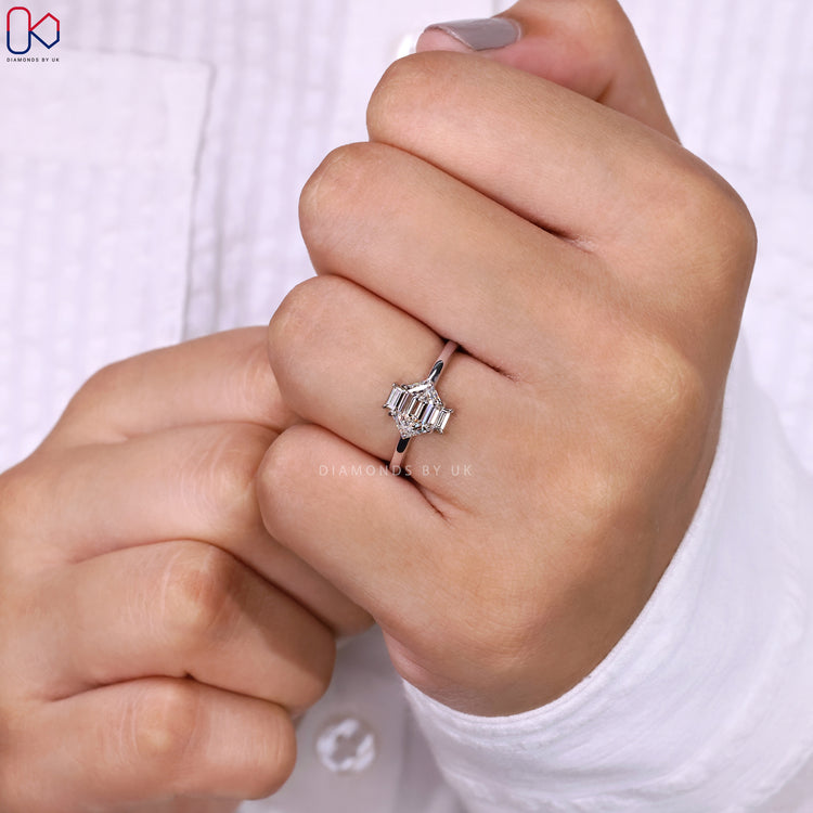 Hexagon diamond ring with baguette side stones.
