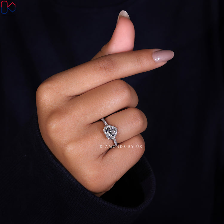 Pave setting ring with a heart cut diamond for added brilliance.
