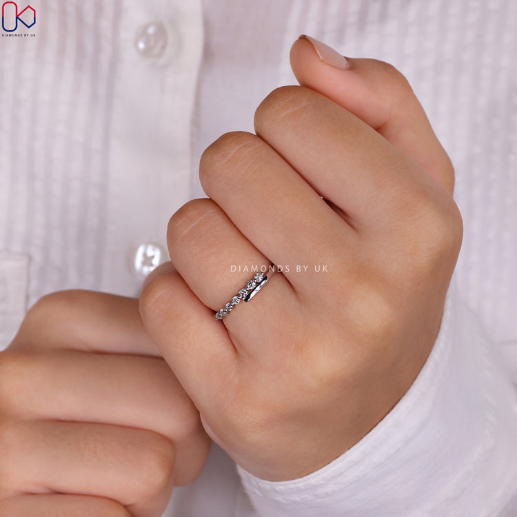 Round diamond wedding band showcasing timeless brilliance and charm.
