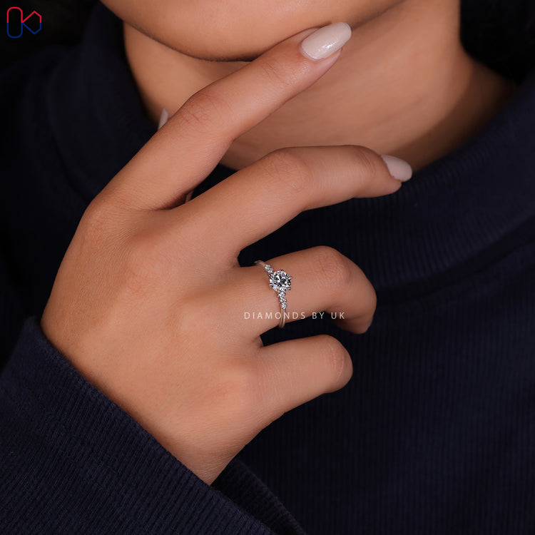Prong setting ring showcasing a brilliant 7 stone diamond ring with a white gold diamond ring.
