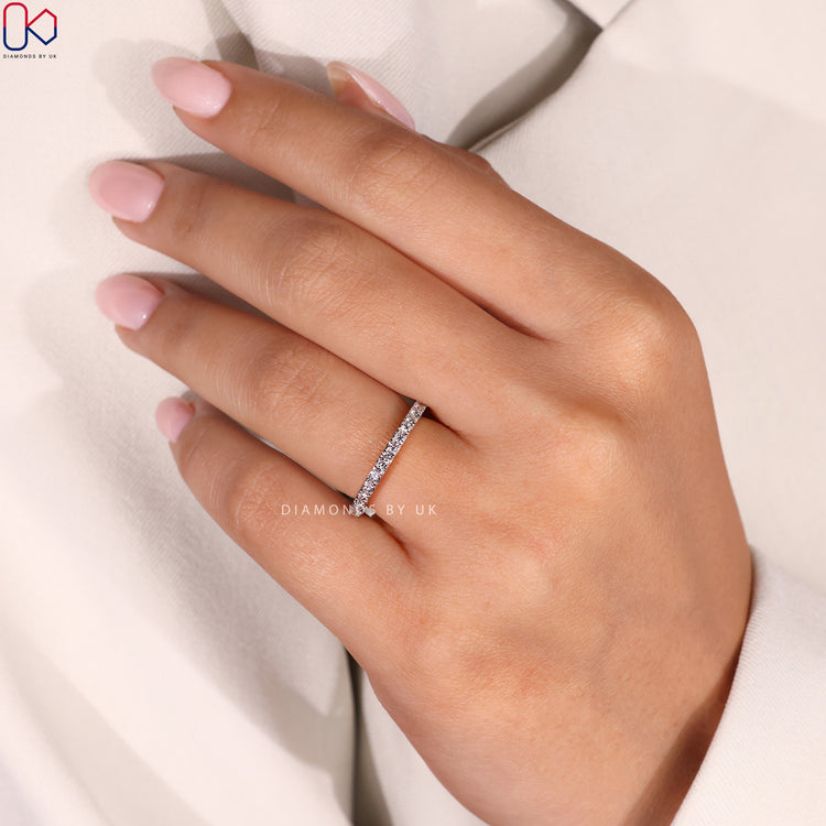 DiamondsbyUK wedding band in white and yellow gold.
