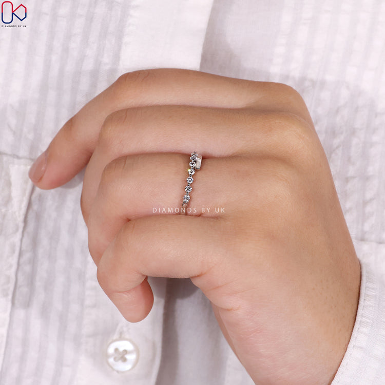 Prong set wedding band ensuring secure diamonds with exceptional sparkle.