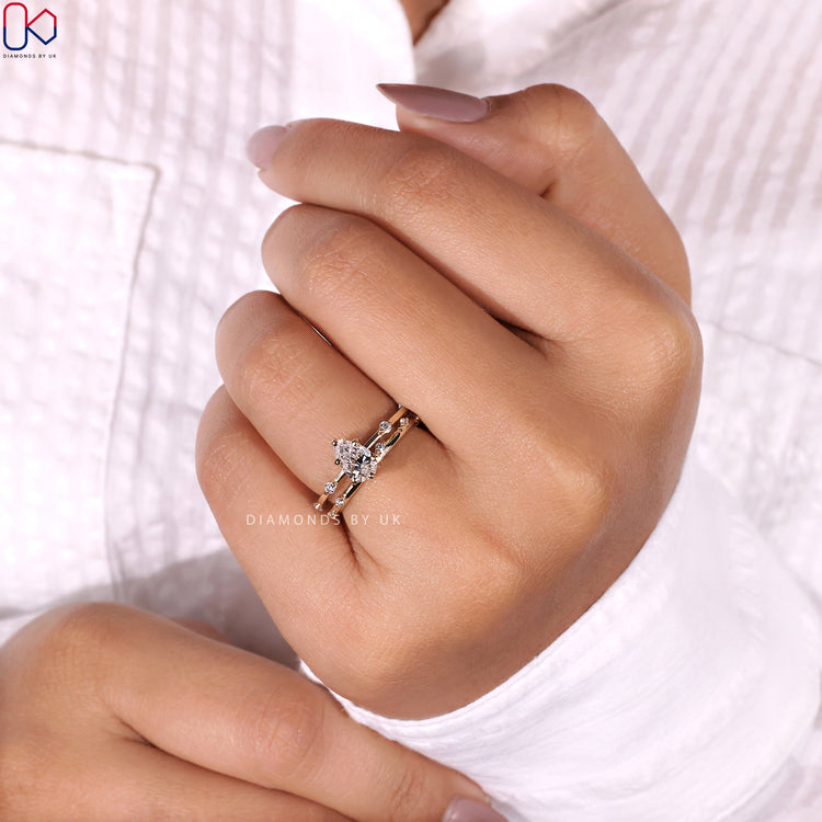 Pear and round cut diamonds sparkle in a perfect match.
