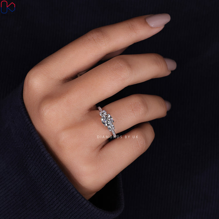 Pave diamond ring featuring sparkling stones in a 3 stone trellis ring setting.