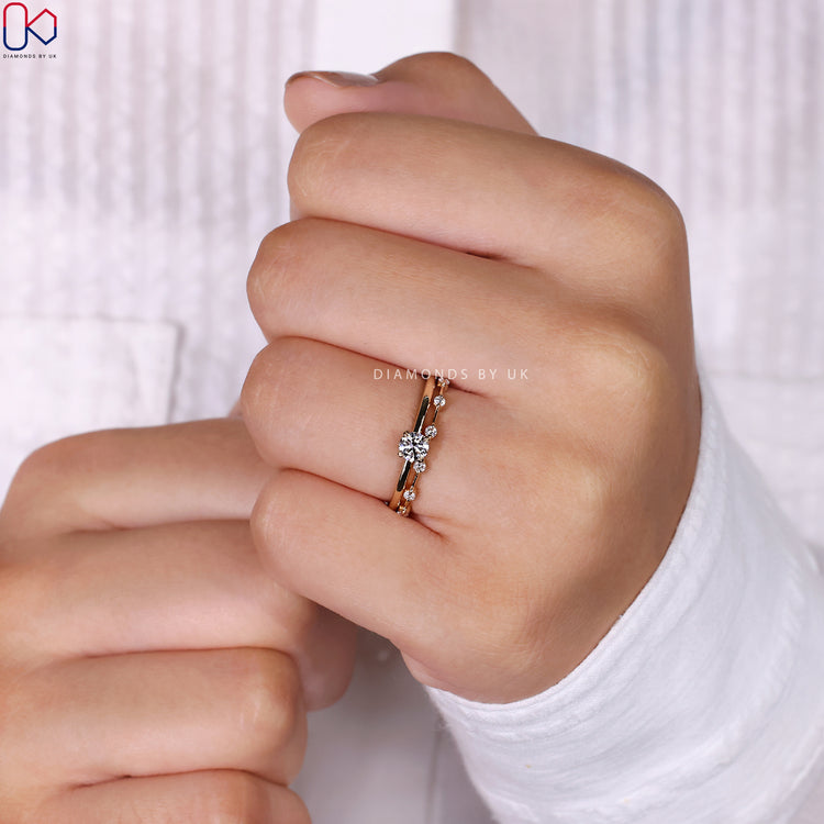 Solitaire engagement ring set in a sleek and modern design.
