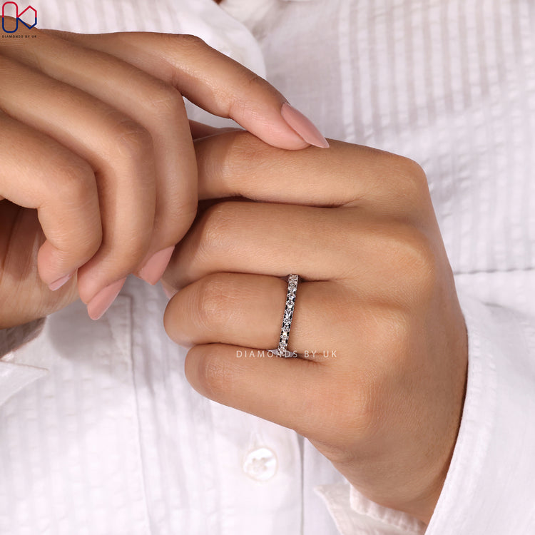 Classic round diamond wedding band designed for brilliance.
