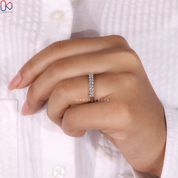 Prong set wedding band offering secure diamond placement and maximum sparkle.
