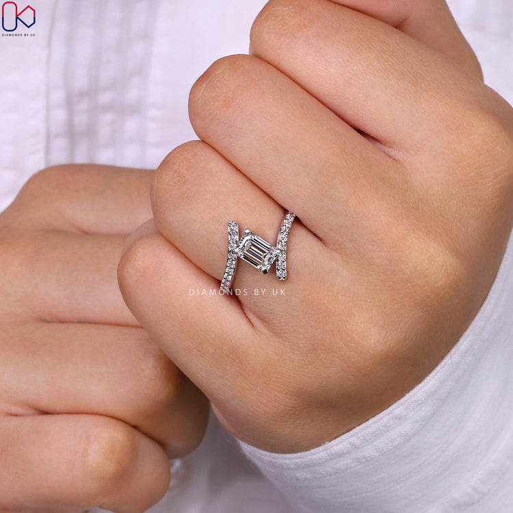 Customize ring with emerald cut and round pave diamonds.
