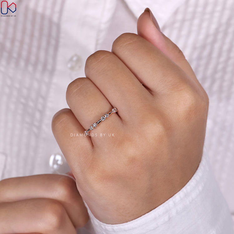 Rose gold wedding band featuring round diamonds for a classic look.
