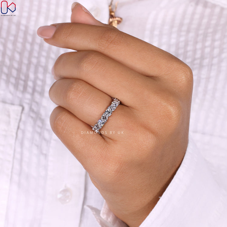 Diamond half eternity band with elegant detailing.
