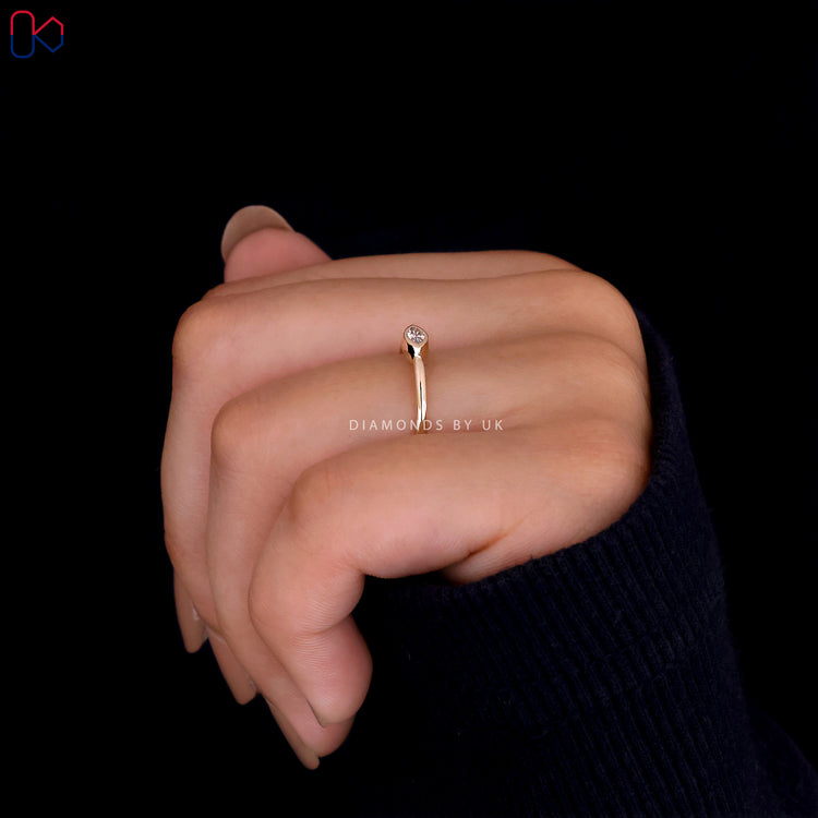 Yellow gold solitaire engagement ring with a diamond
