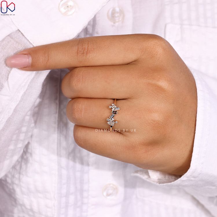 Handmade ring with round diamonds and baguette accents.

