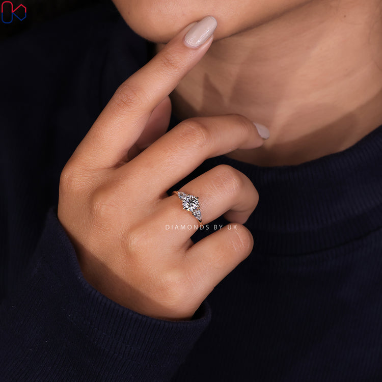 Handmade ring featuring a round diamond ring and elegant pear cut ring design.
