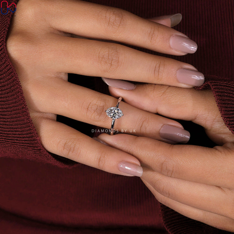 Handmade ring with oval cut diamond in solitaire style.
