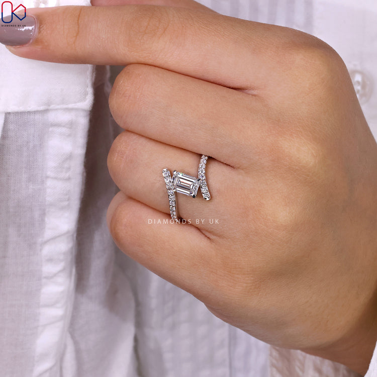 Handmade ring with emerald cut center and 4 prong setting.
