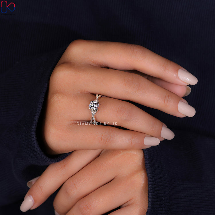 Elegant engagement ring UK featuring a side stone engagement ring with a unique twist.