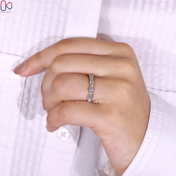 Prong set wedding band crafted for brilliance.
