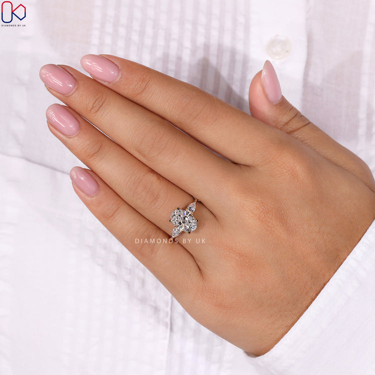 IGI certified oval diamond ring with marquise side stones for a timeless 3 stone diamond engagement ring.
