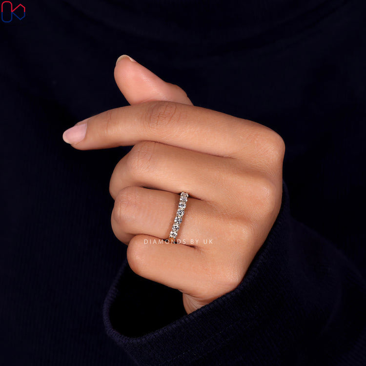 Stunning 7 stone wedding band with sparkling diamonds for a bold statement.
