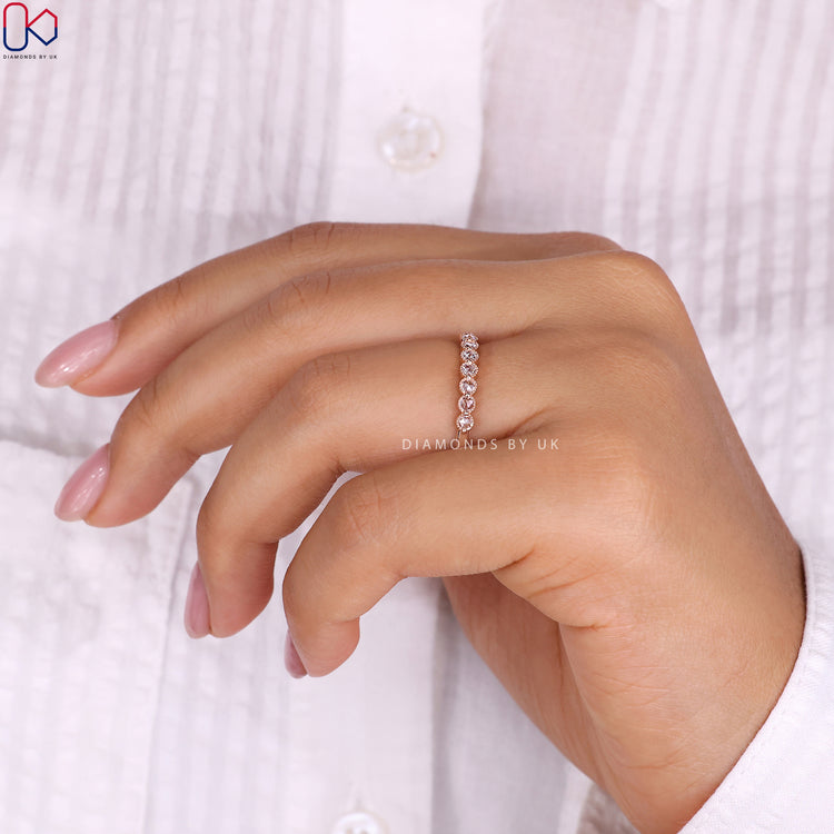 Milgrain band featuring diamonds set in a beautiful rose gold band.
