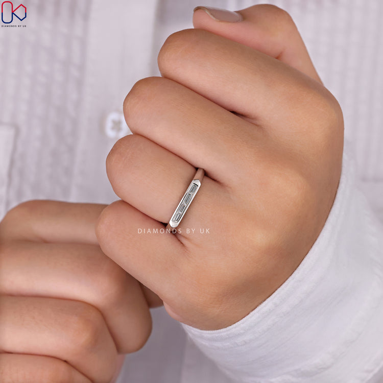 Baguette wedding band showcasing sparkling diamonds in a classic setting.
