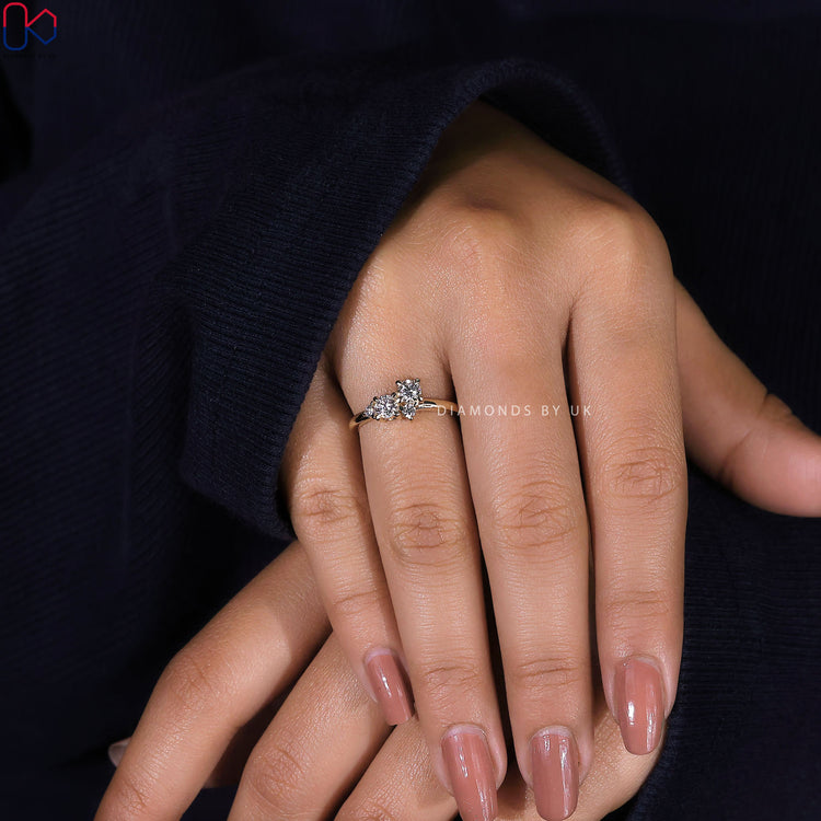 Handmade jewelry ring with round diamonds and claw prongs.
