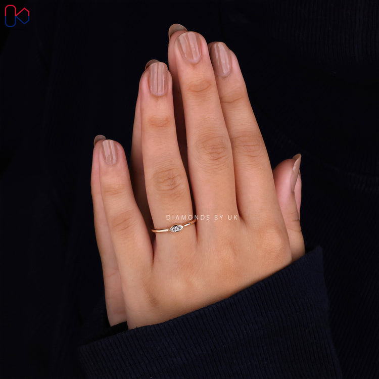 Handmade engagement ring with a marquise diamond
