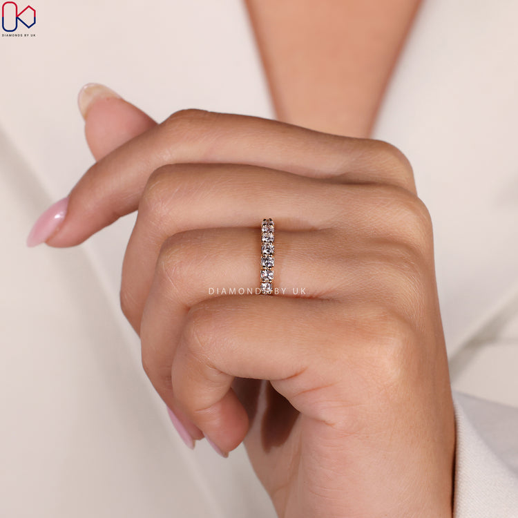 Shared prong band with secure diamond settings.
