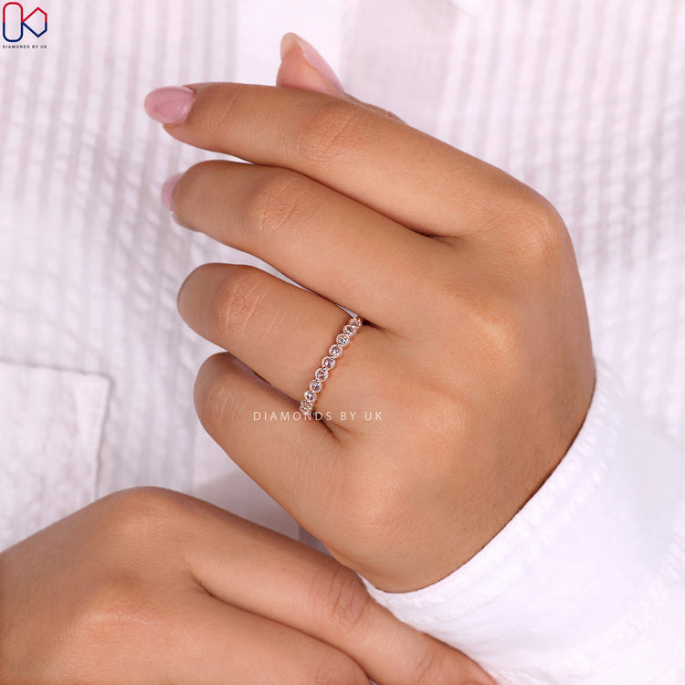 Rose gold eternity band with a Lab Grown Diamond for eco-friendly luxury.
