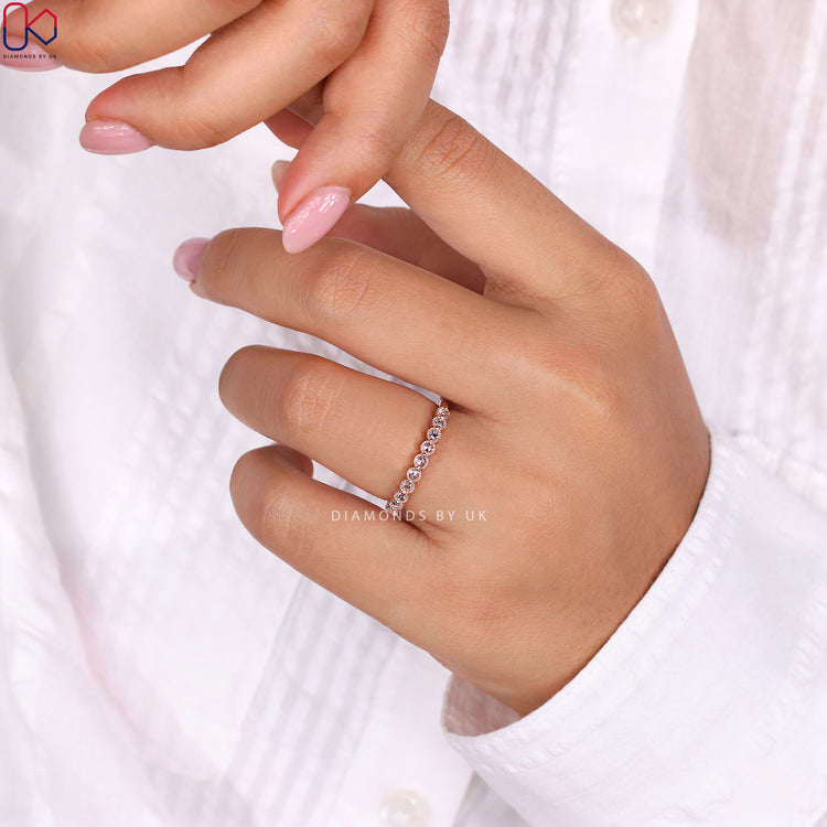 Handmade ring with a rose gold eternity band for a personalized touch.
