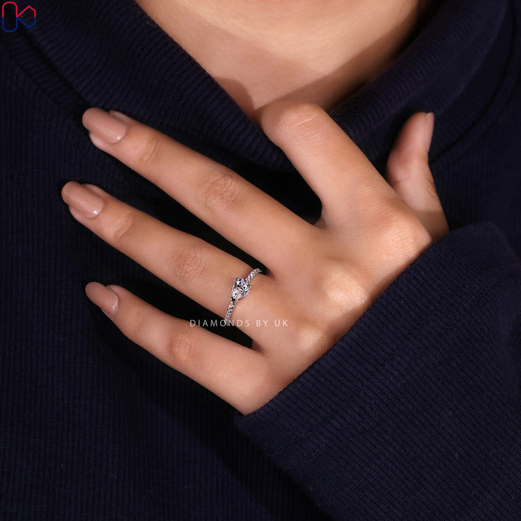 Lab grown diamond ring with V prong and pave band.
