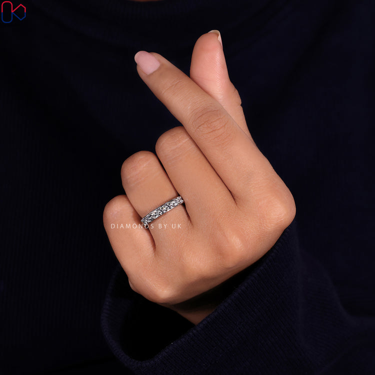 A half eternity diamond wedding band crafted for understated luxury.

