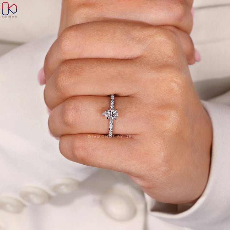 Pave setting pear cut diamond engagement ring.
