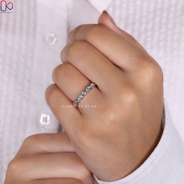Marquise eternity band featuring a continuous line of brilliant diamonds.
