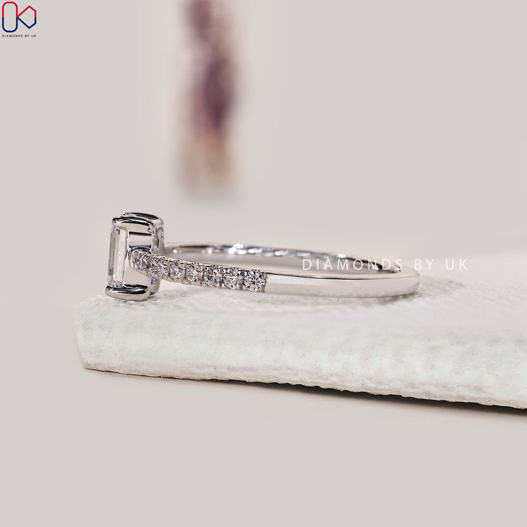 Handmade jewellery with emerald diamond engagement ring.
