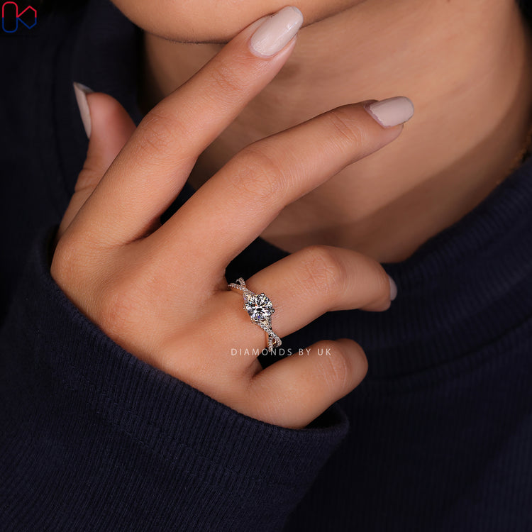 Prong setting ring with a twisted band ring for secure and elegant design.