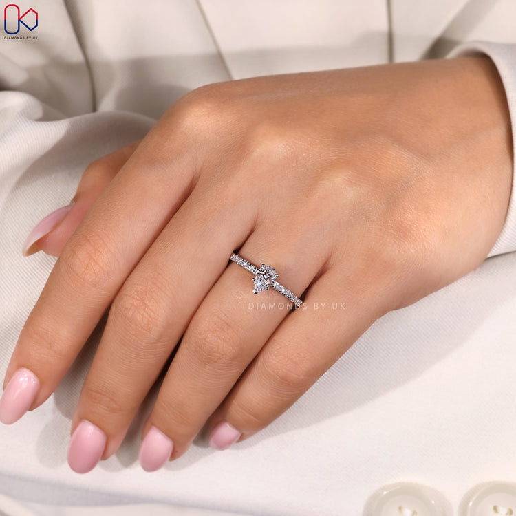 Four prong setting pear cut engagement ring.
