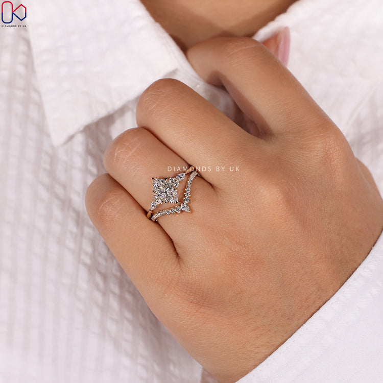 Yellow gold set with a marquise engagement ring and matching band.

