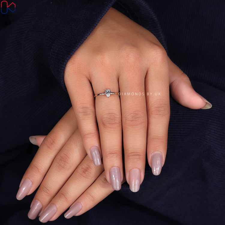 Diamondsbyuk engagement ring with an elegant pear cut diamond solitaire ring.