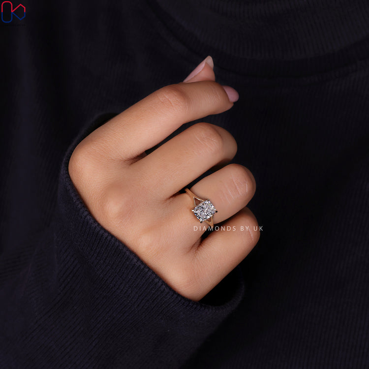 IGI certified elongated cushion cut diamond ring with split shank style.
