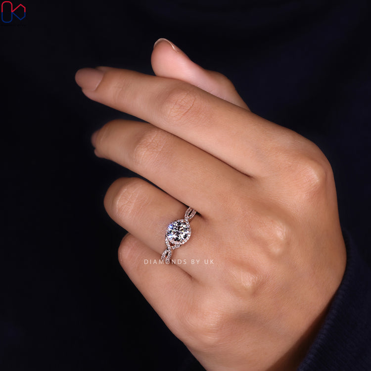 Twisted halo ring featuring prong setting.
