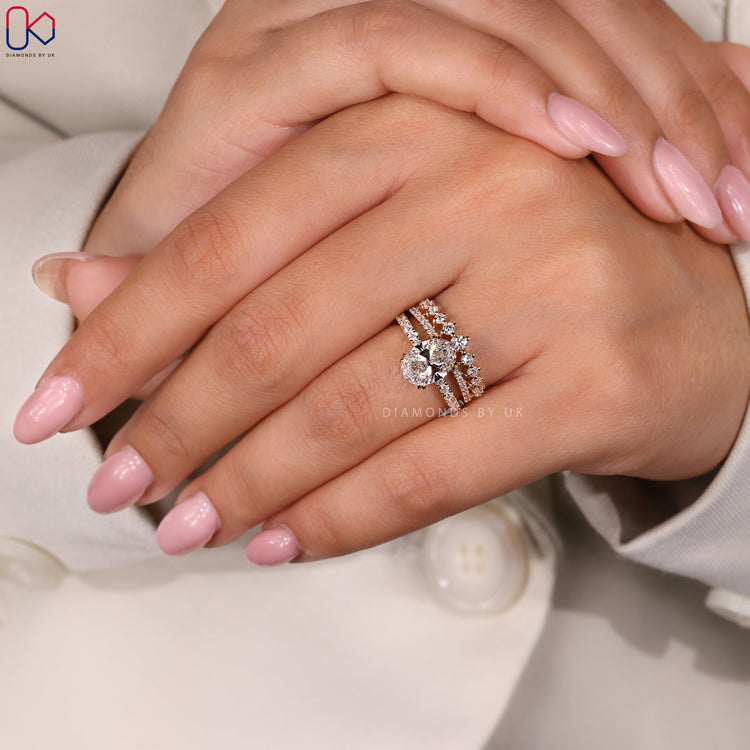 Prong setting wedding band holding round cut diamonds securely.
