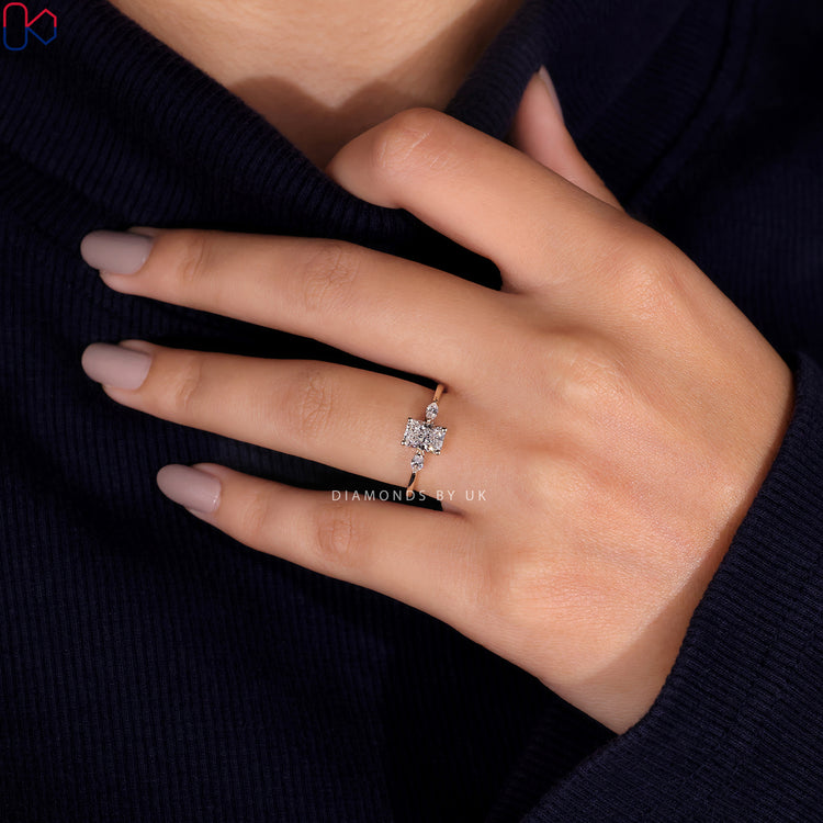 Handmade ring with a radiant cut diamond in a 3 stone setting and marquise side stones.

