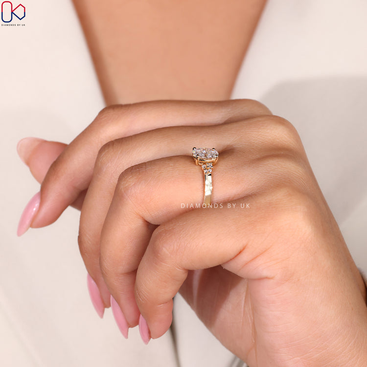 Handmade oval lab-grown diamond ring in yellow gold.
